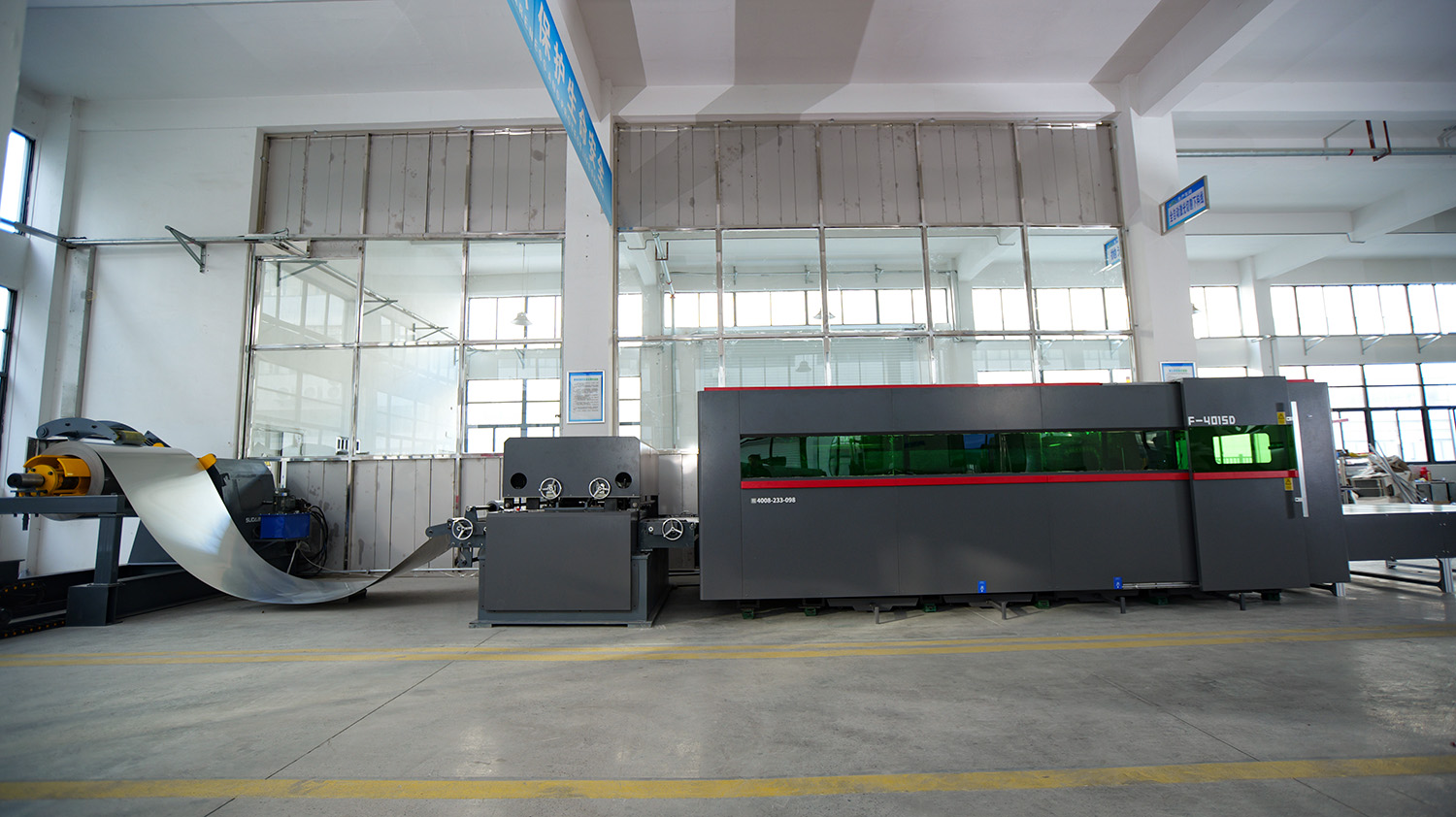 Coil-fed laser cutting machine